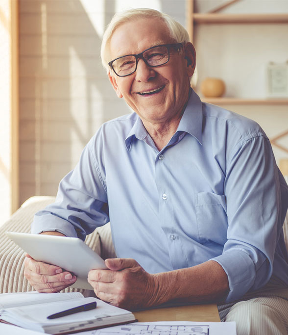 a happy senior man relocated to the best assisted living facility